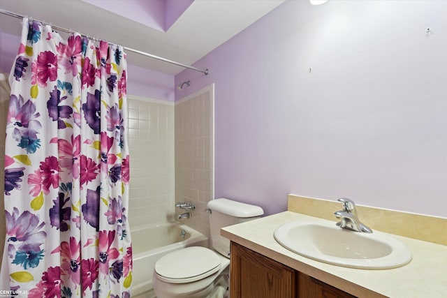 bathroom featuring toilet, vanity, and shower / bath combo