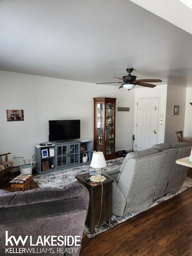 living room featuring wood finished floors and ceiling fan