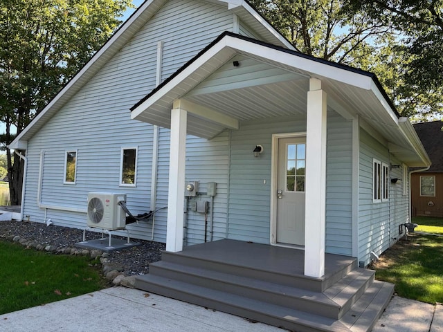 view of front of property featuring a porch and ac unit