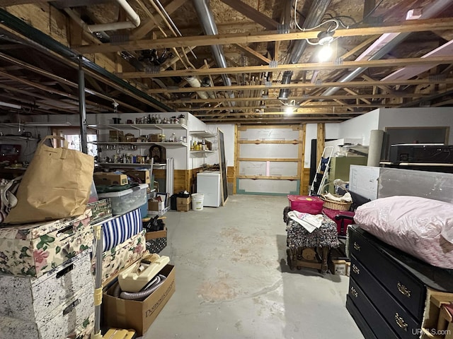 unfinished basement with washer / dryer