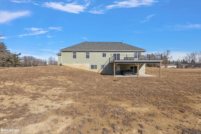 back of property featuring stairs, a patio, and a wooden deck