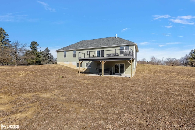 rear view of house featuring a deck