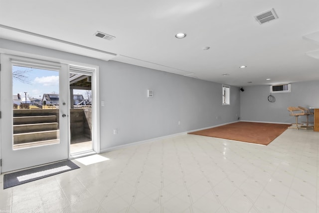 spare room with tile patterned floors, visible vents, baseboards, and recessed lighting