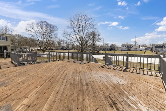 wooden terrace with a residential view