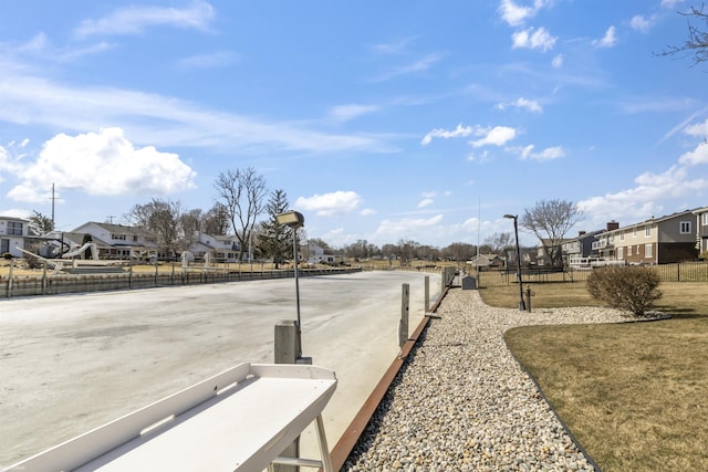 view of road with a residential view and street lighting