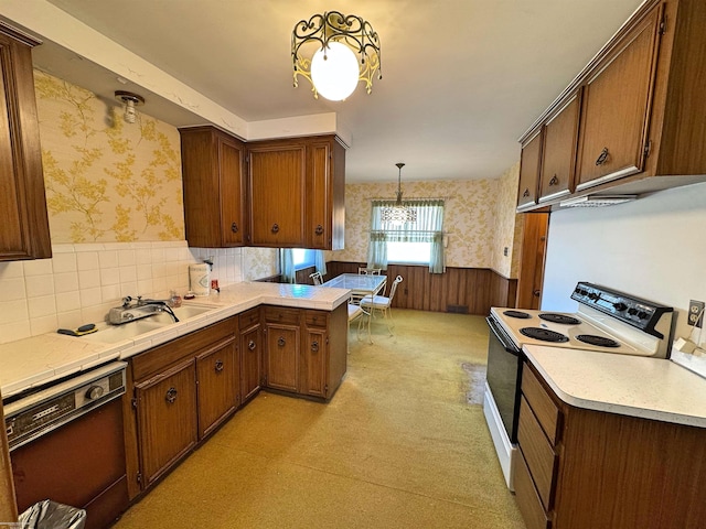 kitchen featuring wallpapered walls, white electric range oven, light countertops, and dishwashing machine