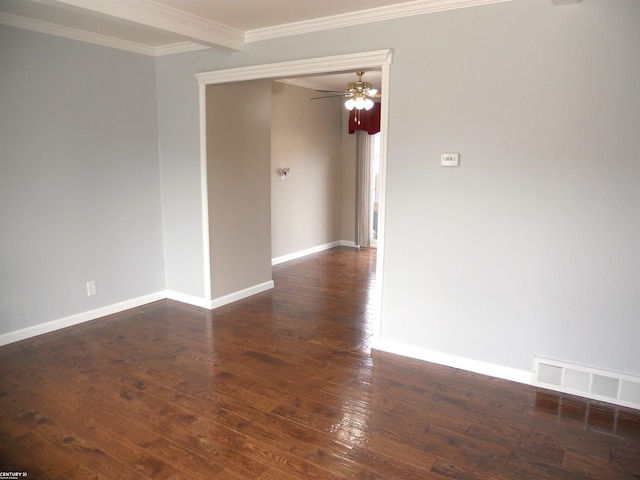 unfurnished room with hardwood / wood-style floors, a ceiling fan, baseboards, visible vents, and crown molding