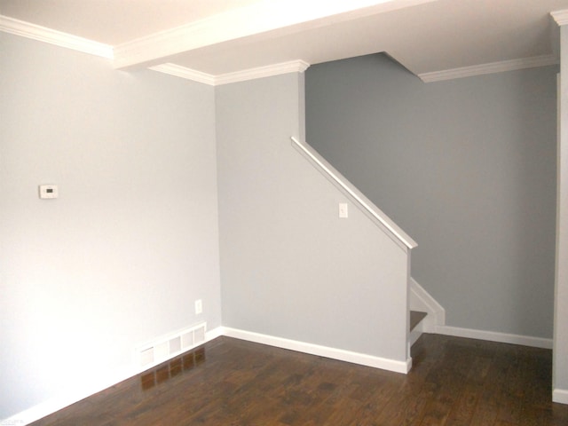 below grade area featuring visible vents, stairway, wood finished floors, and ornamental molding