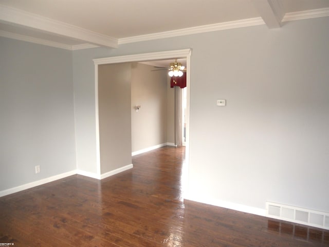 unfurnished room with visible vents, beamed ceiling, crown molding, and wood finished floors