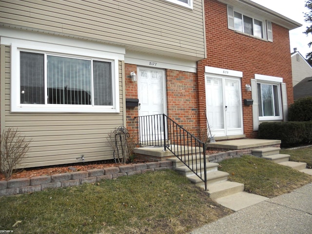 entrance to property with brick siding