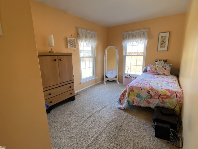 bedroom with baseboards and carpet flooring