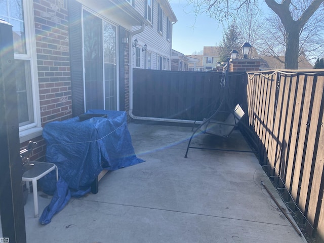 view of patio / terrace featuring fence