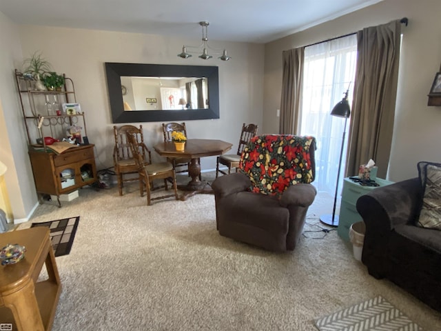 living room featuring carpet flooring and baseboards