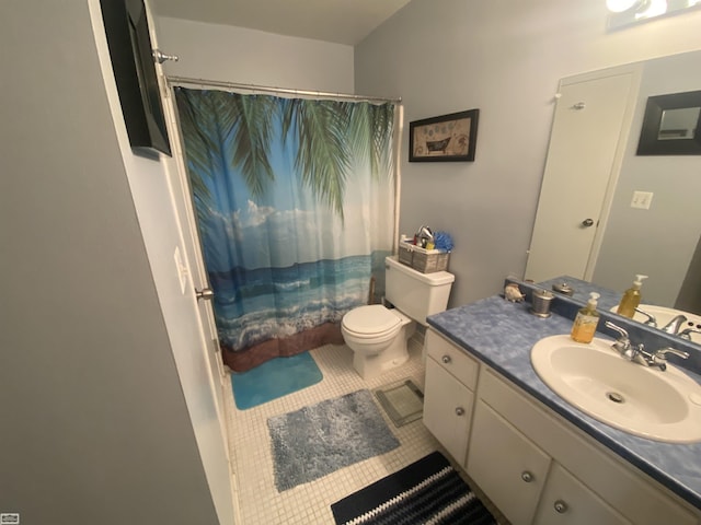 full bathroom with tile patterned flooring, curtained shower, toilet, and vanity