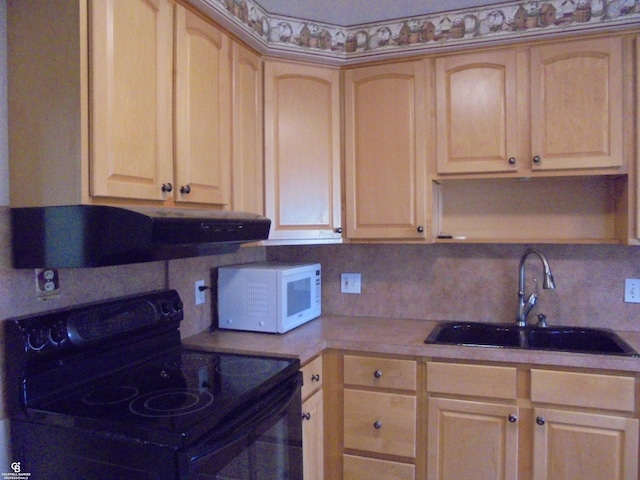 kitchen with white microwave, ventilation hood, light brown cabinetry, black electric range, and a sink