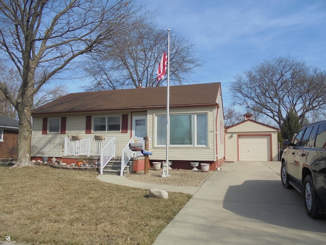 view of front facade featuring a front lawn, driveway, a detached garage, roof with shingles, and an outdoor structure