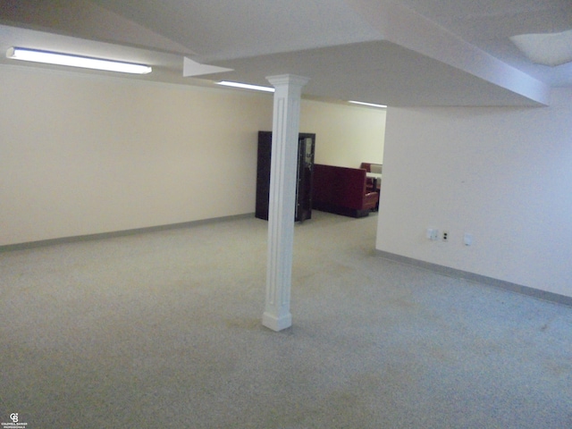 finished basement with baseboards and light colored carpet