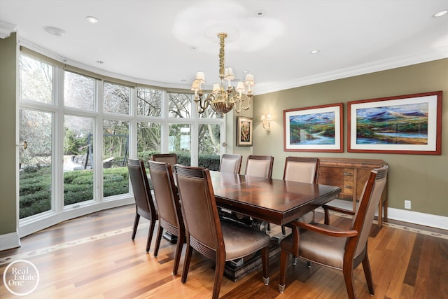 dining room with recessed lighting, crown molding, light wood finished floors, baseboards, and a chandelier