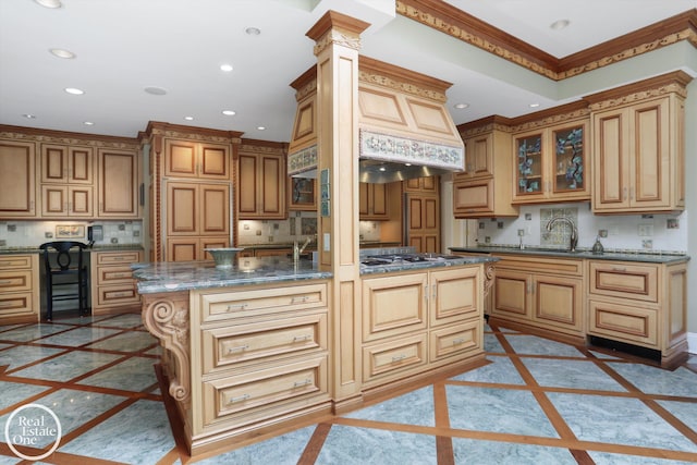 kitchen featuring recessed lighting, decorative backsplash, and stainless steel gas stovetop