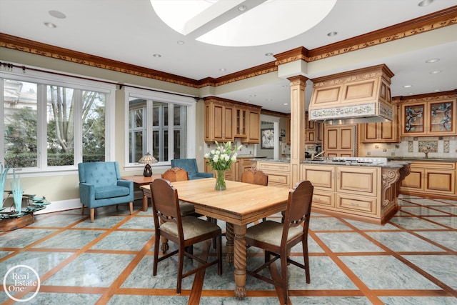 dining room with crown molding, decorative columns, recessed lighting, and baseboards