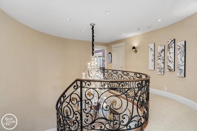 stairway featuring recessed lighting, carpet, baseboards, and a chandelier