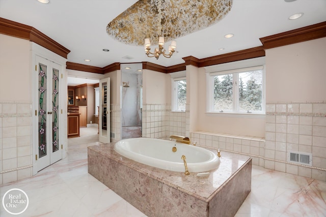 bathroom with a garden tub, tile walls, marble finish floor, and a shower stall