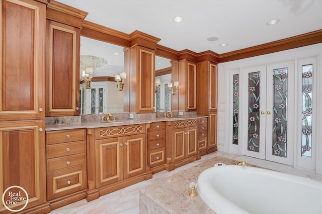 full bathroom with a tub to relax in, a sink, recessed lighting, french doors, and double vanity