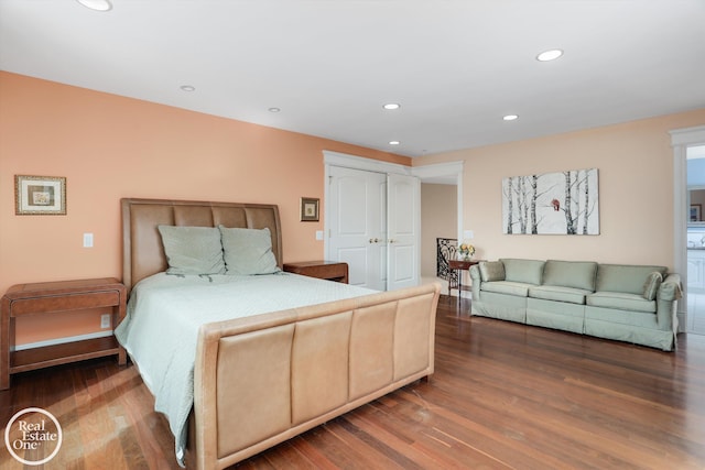 bedroom with recessed lighting and wood finished floors