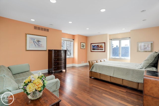 bedroom featuring recessed lighting, wood finished floors, visible vents, and baseboards