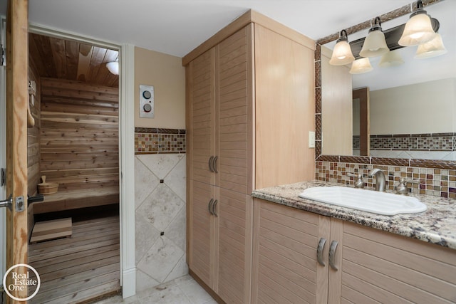 bathroom with a sauna, tile walls, and vanity