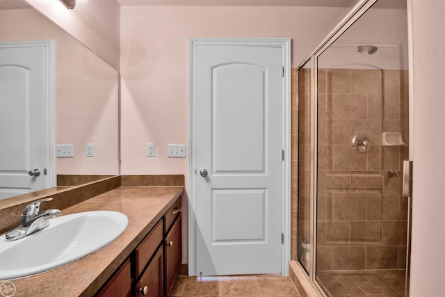 bathroom with vanity, a shower stall, and tile patterned flooring