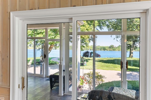 doorway to outside featuring a water view