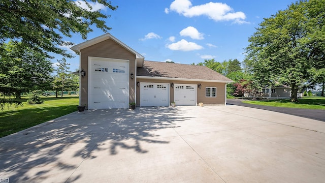 exterior space with a front lawn and roof with shingles