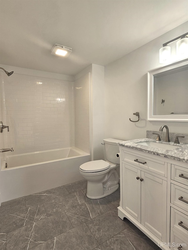 full bath with vanity,  shower combination, toilet, and marble finish floor