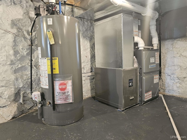 utility room featuring gas water heater and heating unit