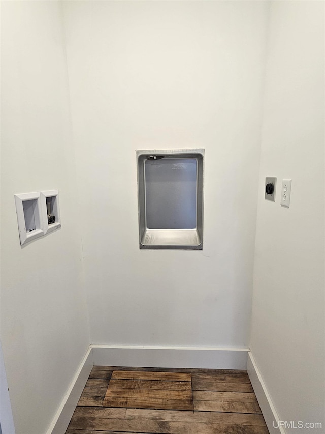 washroom with hookup for a washing machine, wood finished floors, baseboards, and electric dryer hookup