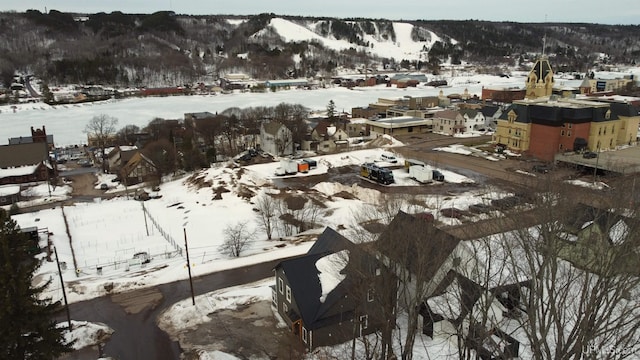 snowy aerial view featuring a residential view