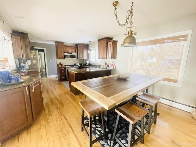 dining room featuring light wood-style floors