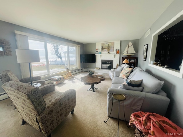 carpeted living area with visible vents and a large fireplace