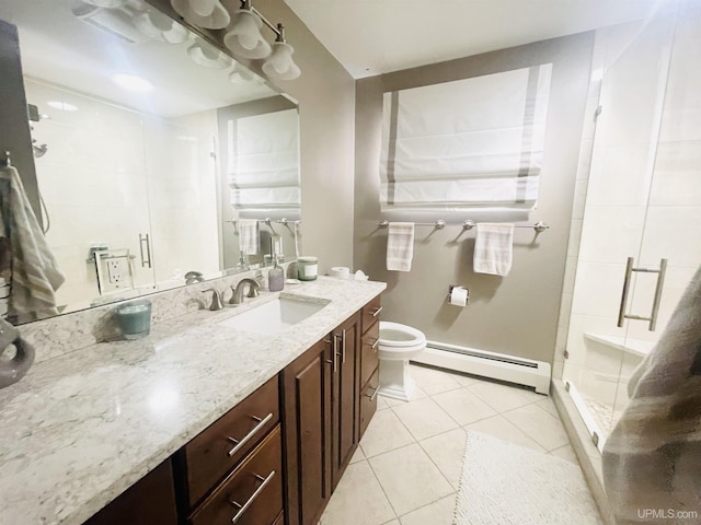 bathroom featuring tile patterned floors, baseboard heating, a stall shower, and vanity