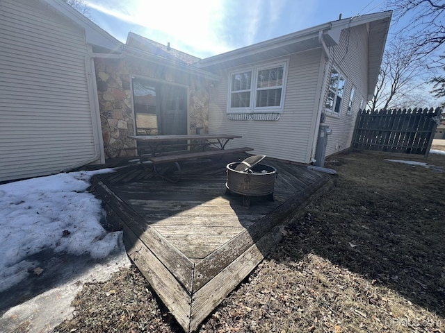 back of house featuring a deck and fence