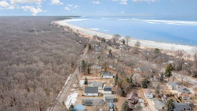 bird's eye view featuring a water view and a view of the beach