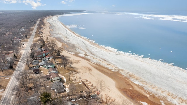 aerial view featuring a water view and a view of the beach