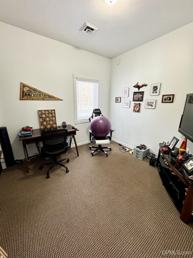 office area with baseboards, visible vents, and carpet floors