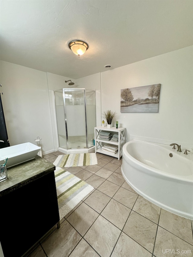 bathroom featuring vanity, visible vents, a stall shower, tile patterned flooring, and a bath