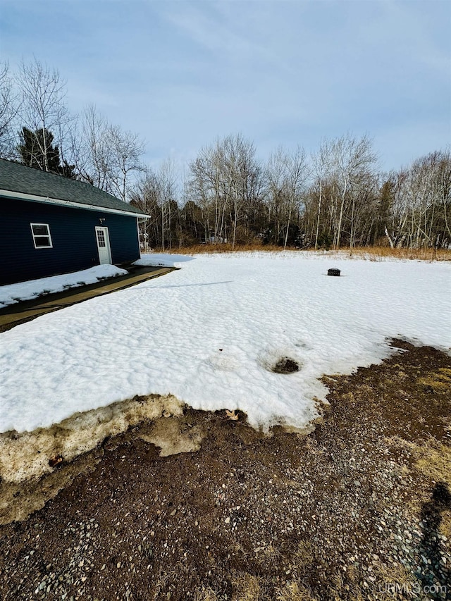 view of yard layered in snow