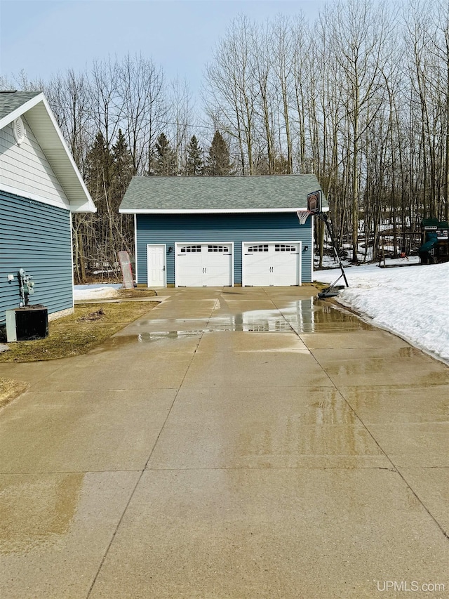 detached garage featuring central AC