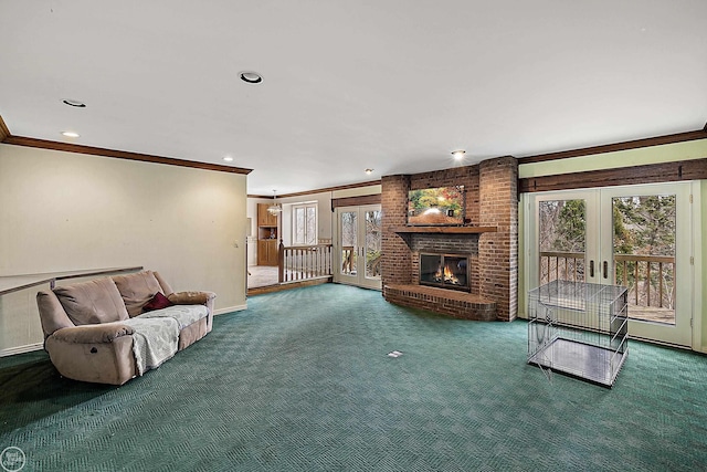 carpeted living area with a brick fireplace, baseboards, ornamental molding, recessed lighting, and french doors