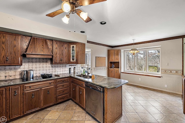 kitchen featuring dishwashing machine, custom exhaust hood, a peninsula, a sink, and wainscoting