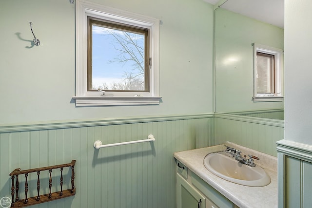 bathroom with vanity and wainscoting